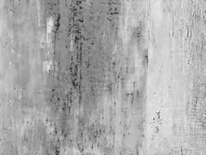 Die Wand zeigt die elegante Textur von Oberflaeche-STUCCORINO-Alt-Berlin in warmen Grautönen für kreative Wandgestaltung.