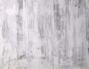 Eine kreative Wandgestaltung mit STUCCORINO-Fresco-Natur zeigt elegante, graue Strukturen für modernes Wohndesign.