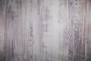 Das Bild zeigt eine edle Wandgestaltung mit STUCCORINO von EINHORN WERKE, einem besonders dekorativen Kalk-Marmorputz für dekorative Highlights in jedem Raum.