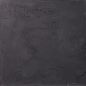 Eine dunkle, strukturierte Wand zeigt die elegante Oberfläche des STUCCORINO Kalkputzes von Einhorn Werke für kreative Wandgestaltung.