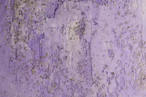 Das Bild zeigt eine edle Wandgestaltung mit STUCCORINO von EINHORN WERKE, einem dekorativen Kalkputz. Rezept: Sparkle STUCCORINO ® 0,1 Farbtön + 4020 + Natur + Goldglimmer mittel
