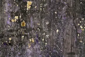 Das Bild zeigt eine edle Wandgestaltung mit STUCCORINO von EINHORN WERKE, einem dekorativen Kalkputz. Rezept: Sparkle STUCCORINO ® 0,1 Farbtöne 0215 + 4020 + 4040 + Goldglimmer grob