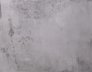 Das Bild zeigt eine edle und fugenlose Betonoptik Wandgestaltung mit STUCCORINO von EINHORN WERKE, einem Marmor Kalkputz. STUCCORINO ® Torino Beton STUCCORINO ® 0,5 Farbton 0303 + Imprägnierung + Shabby Finish - schwarz
