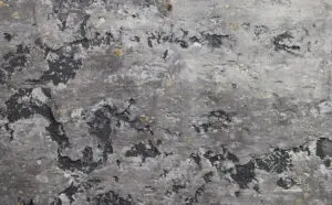 Die Wand zeigt eine kreative Oberflächengestaltung mit Einhornwerke Kalkputz und natürlichem Goldglimmer. Rezept: Unikat STUCCORINO ® 0,1 Farbtöne 0215 + 0205 + 0203 + Natur + Goldglimmer mittel