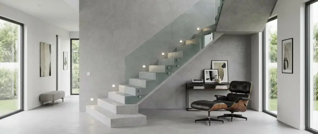 Ein stilvolles Wohnzimmer mit einer fugenlos gespachtelten Treppe von Einhornwerke, umgeben von moderner Wandgestaltung.