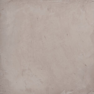 Eine Wand mit glatter, rosafarbener Oberflächenstruktur zeigt die elegante Wandgestaltung mit Marrakesh Kalkputz. STUCCORINO 0,1 - Farbton: 2004