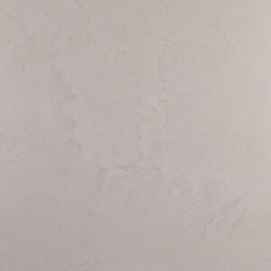 Eine schlichte Wand zeigt den eleganten Marmorputz von Einhornwerke, ideal für moderne Wandgestaltung im Wohnzimmer.