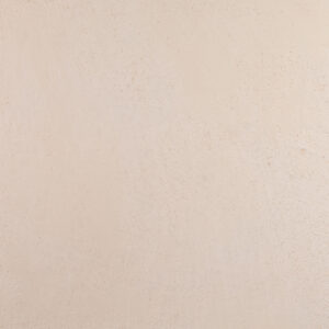 Eine gleichmäßige, cremefarbene Wand mit feiner Textur zeigt die elegante Wandgestaltung von Einhornwerke.