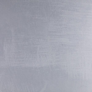 Eine graue Wand mit feiner Struktur zeigt die elegante Wirkung von Marmorputz in der modernen Wandgestaltung.