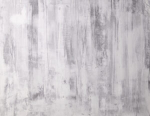 Eine kreative Wandgestaltung mit STUCCORINO-Fresco-Natur zeigt elegante, graue Strukturen für modernes Wohndesign.