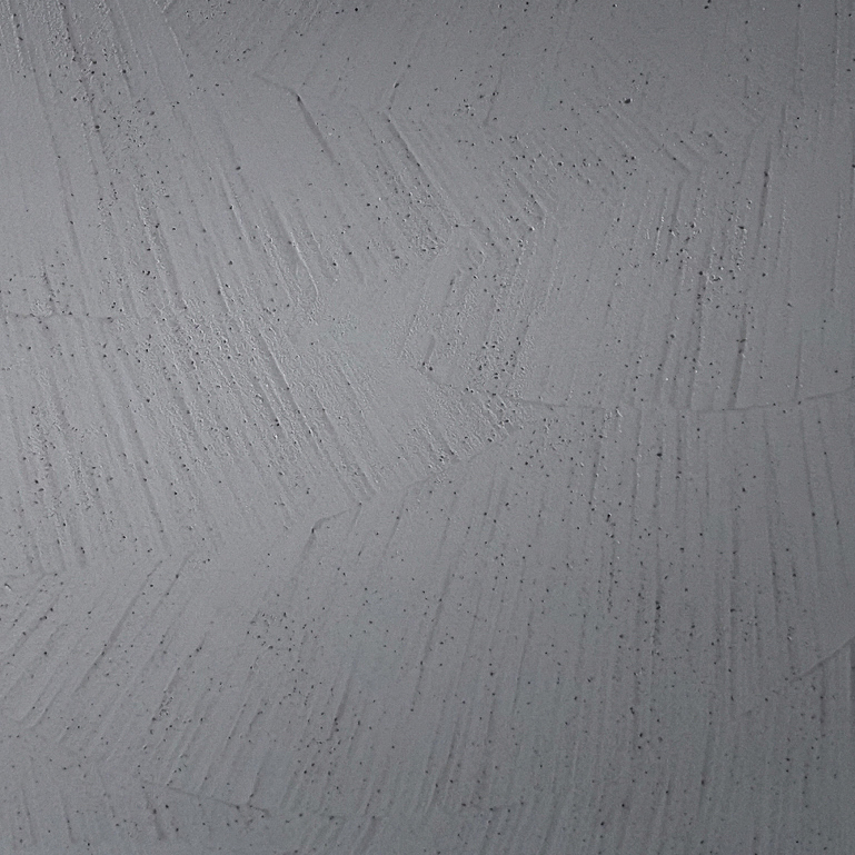 Diese graue Bodenbeschichtung in Betonoptik von Einhornwerke zeigt ein stilvolles, strukturiertes Muster.